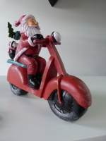 Kerstman op scooter