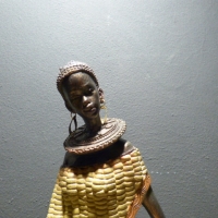 Afrikaanse vrouw corn/zittend