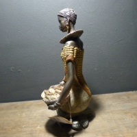 Afrikaanse vrouw corn/zittend